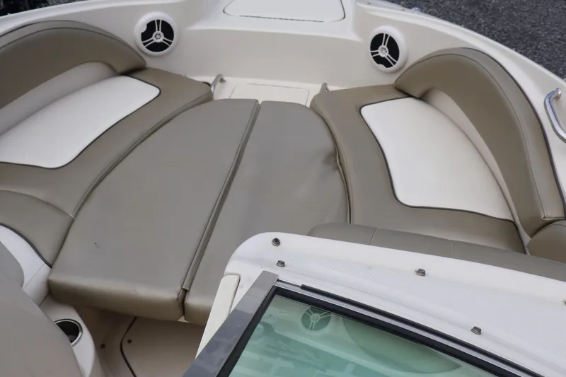 Slide: The Image of 2007 Sea Ray 220 Sundeck interior with beige and white seating. - 47