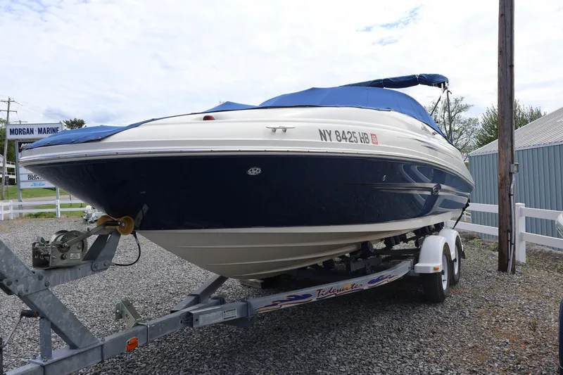 Slide: The Image of 2007 Sea Ray 220 Sundeck boat on trailer, covered and parked at Morgan Marine. - 5
