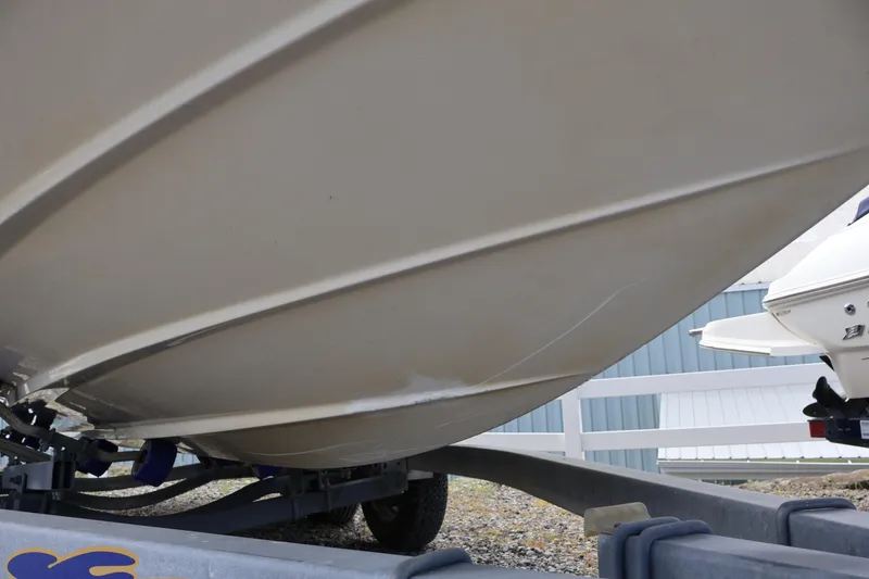 Slide: The Image of 2007 Sea Ray 220 Sundeck boat hull on trailer, close-up view. - 53