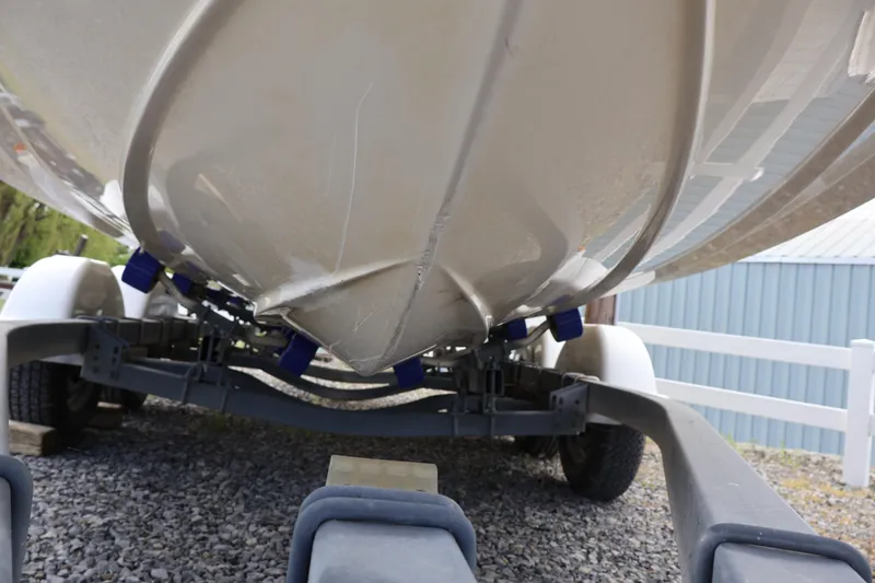 Slide: The Image of Underneath view of a 2007 Sea Ray 220 Sundeck on a trailer. - 59