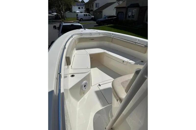 Slide: The Image of 2016 Cobia 277 Center Console boat with spacious seating and sleek design. - 6