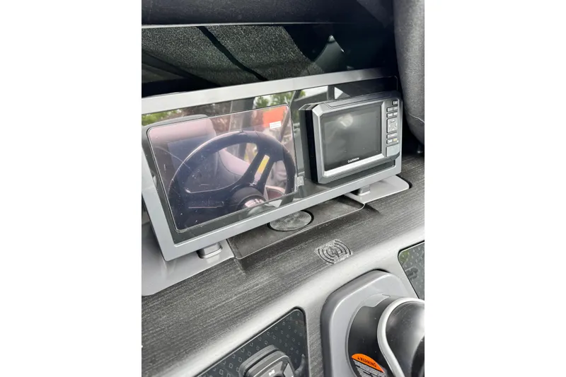 Slide: The Image of Dashboard of 2026 Bennington 23 M Center Swingback with steering wheel and Garmin display. - 8