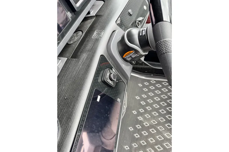 Slide: The Image of Dashboard of 2026 Bennington 23 M Center Swingback with modern controls and steering wheel. - 9