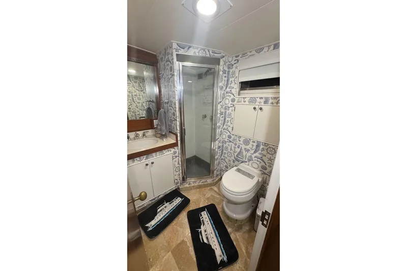 Slide: The Image of Bathroom interior of a 1974 Burger 67 Motor Yacht with nautical-themed decor. - 15