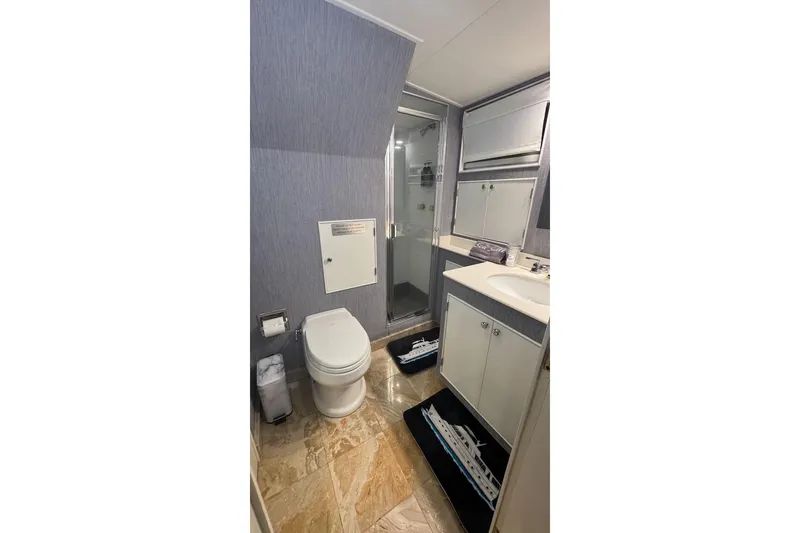 Slide: The Image of Bathroom interior of 1974 Burger 67 Motor Yacht with modern fixtures and marble flooring. - 20