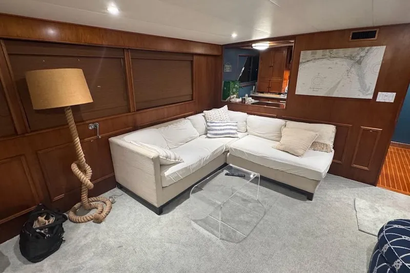 Slide: The Image of Luxurious 1974 Burger 67 Motor Yacht interior with cozy seating and nautical decor. - 3