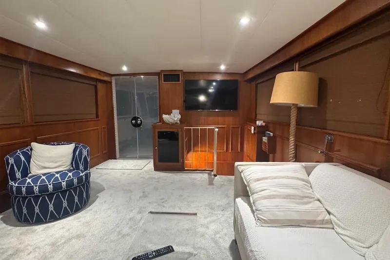Slide: The Image of Luxurious interior of a 1974 Burger 67 Motor Yacht with elegant furnishings and ambient lighting. - 5