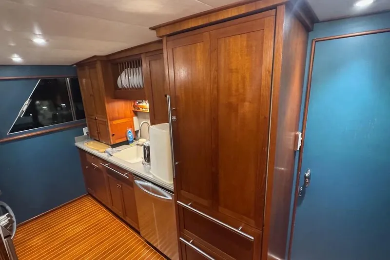 Slide: The Image of Luxurious wooden kitchen interior on a 1974 Burger 67 Motor Yacht. - 7