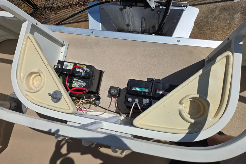 Slide: The Image of Battery compartment of a 2010 Bentley Pontoons 200 Fish boat, showing wiring and components. - 10