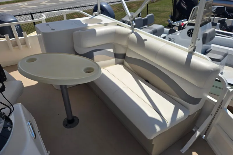 Slide: The Image of 2010 Bentley Pontoons 200 Fish interior with cushioned seating and oval table. - 15