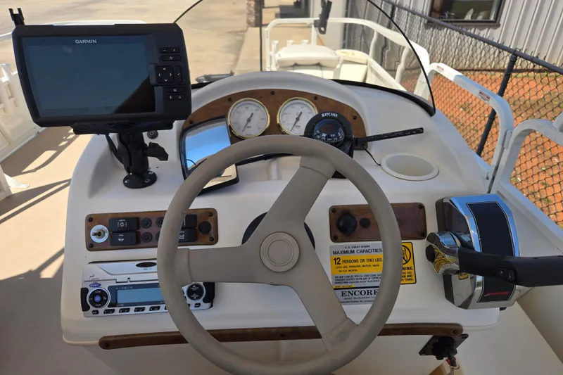 Slide: The Image of Steering console of a 2010 Bentley Pontoons 200 Fish with Garmin GPS and control panel. - 6