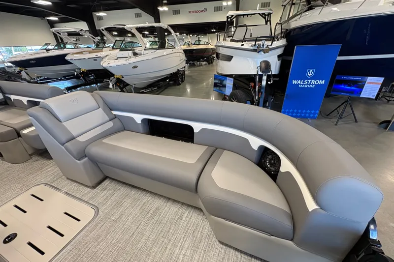 Slide: The Image of Luxurious seating on 2027 Premier 250 Sunsation RS - CL pontoon boat at Walstrom Marine showroom. - 8
