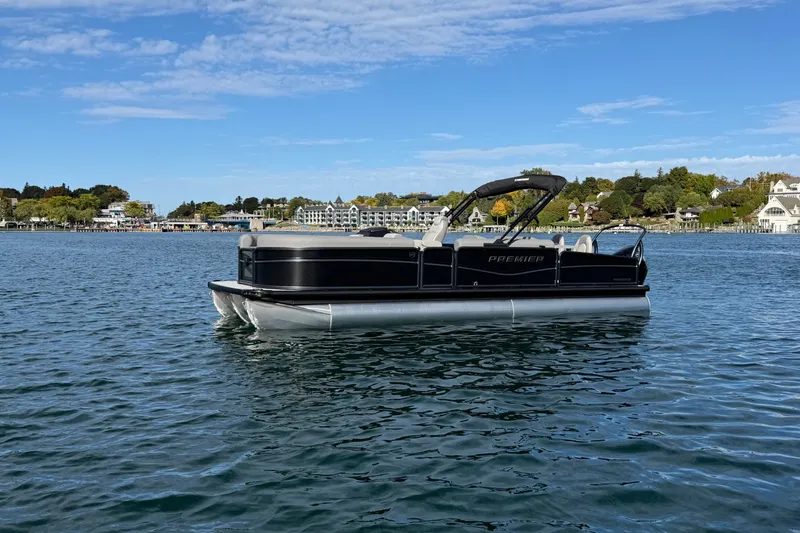 The Image of 2027 Premier 250 Sunsation RS - CL pontoon boat on a scenic lake. - 0
