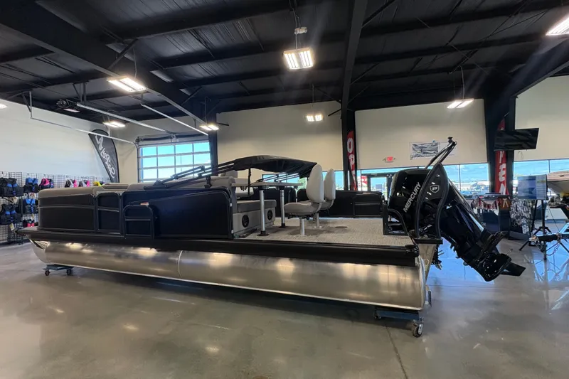 Slide: The Image of 2027 Premier 250 Sunsation RS - CL pontoon boat displayed indoors. - 2