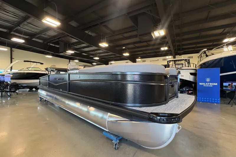 Slide: The Image of 2027 Premier 250 Sunsation RS - CL pontoon boat displayed indoors at Walstrom Marine showroom. - 3