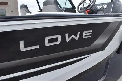 Slide: The Image of 2026 Lowe Fishing Machine 1875 boat, sleek design with modern steering console. - 13