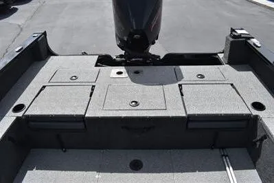 Slide: The Image of 2026 Lowe Fishing Machine 1875 boat deck with storage compartments and motor. - 18