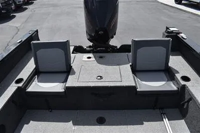 Slide: The Image of 2026 Lowe Fishing Machine 1875 boat interior with two seats and motor. - 19