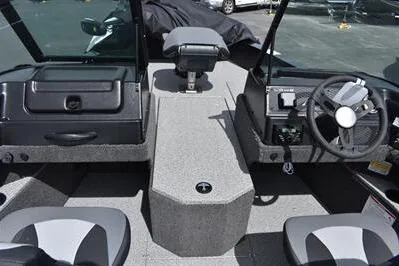 Slide: The Image of 2026 Lowe Fishing Machine 1875 interior with steering wheel and seating. - 26