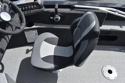 Slide: The Image of 2026 Lowe Fishing Machine 1875 boat interior with steering wheel and cushioned seat. - 34