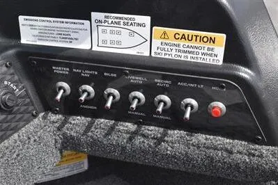 Slide: The Image of Control panel of 2026 Lowe Fishing Machine 1875 with caution and seating labels. - 38