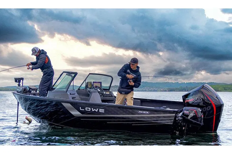 Slide: The Image of Manufacturer Provided Image: Two people fishing on a 2025 Lowe Fishing Machine 1875 boat under cloudy skies. - 41