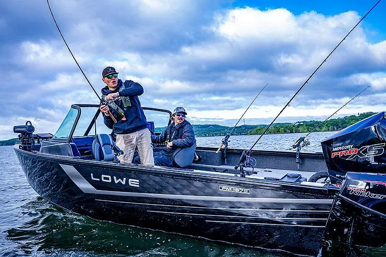 Slide: The Image of Manufacturer Provided Image: 2025 Lowe Fishing Machine 1875 on a lake with two anglers fishing. - 42