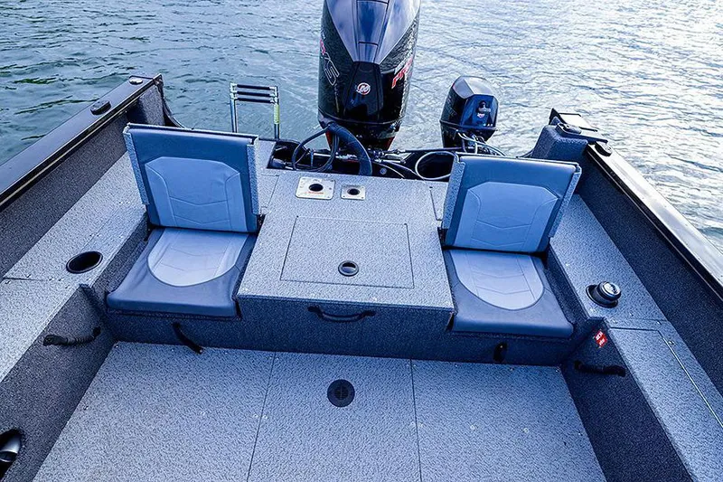 Slide: The Image of Manufacturer Provided Image: 2025 Lowe Fishing Machine 1875 boat interior with two seats and motor on water. - 46
