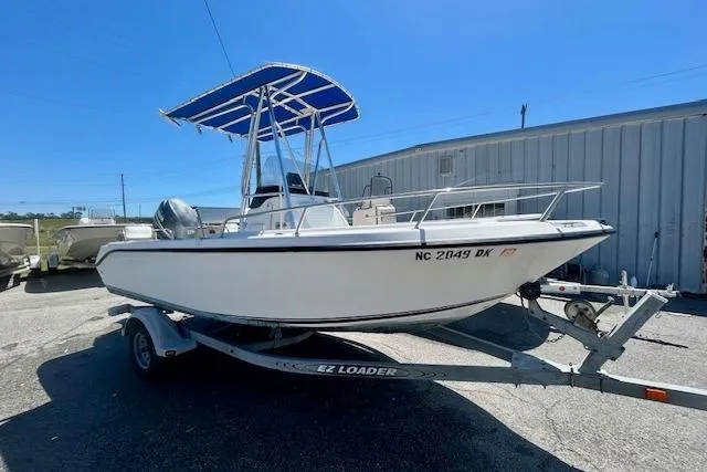 Slide: The Image of 2007 Century 1801 Center Console boat on EZ Loader trailer, parked outdoors. - 1
