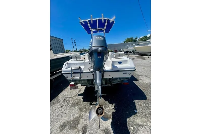 Slide: The Image of 2007 Century 1801 Center Console boat with outboard motor, parked outdoors. - 11