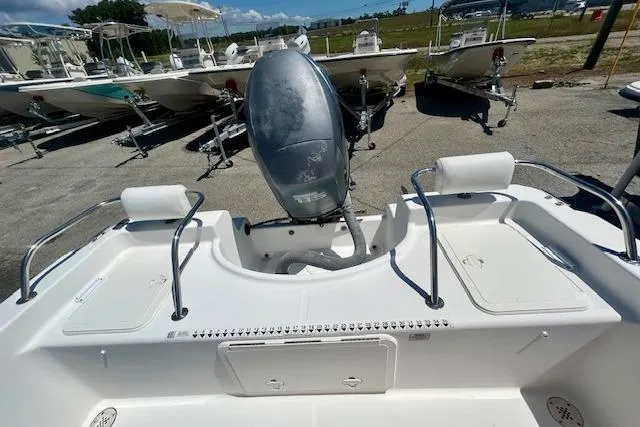 Slide: The Image of 2007 Century 1801 Center Console boat with outboard motor, docked in a marina. - 4