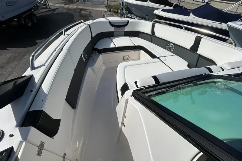 Slide: The Image of 2023 Chaparral 280 OSX boat interior with spacious seating and modern design. - 17