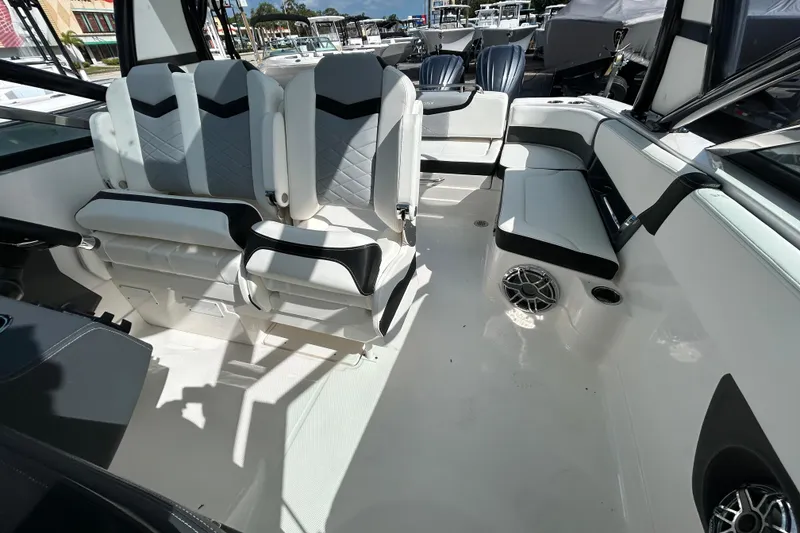 Slide: The Image of Interior of 2023 Chaparral 280 OSX boat with modern seating and sleek design. - 19