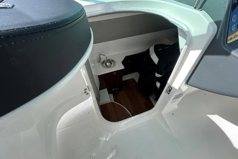 Slide: The Image of Interior cabin of 2023 Chaparral 280 OSX boat with sink and storage area. - 20