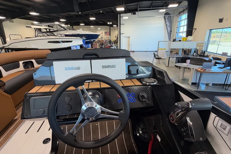 Slide: The Image of Cockpit of 2027 Premier 230 Solaris RF - CL boat with Simrad displays. - 14