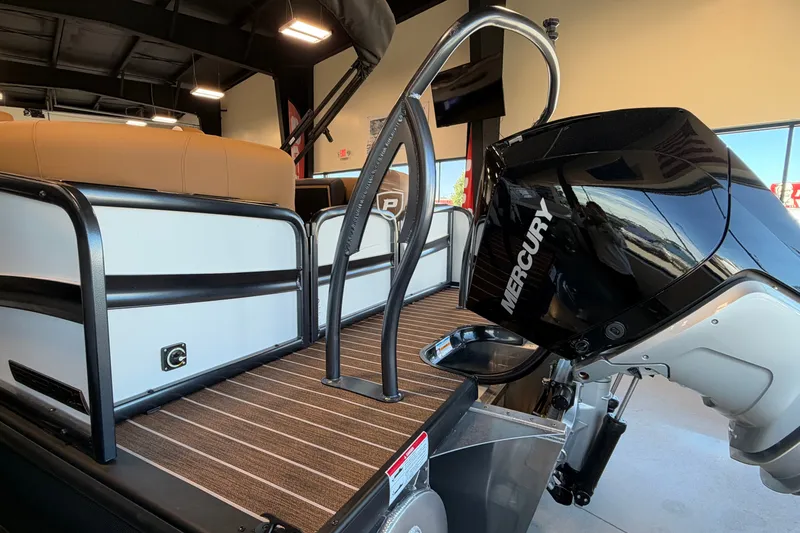 Slide: The Image of 2027 Premier 230 Solaris RF - CL boat with Mercury engine in showroom. - 5