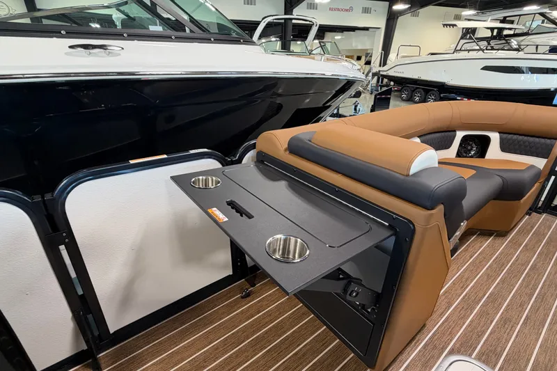Slide: The Image of 2027 Premier 230 Solaris RF - CL boat interior with seating and foldable table. - 13