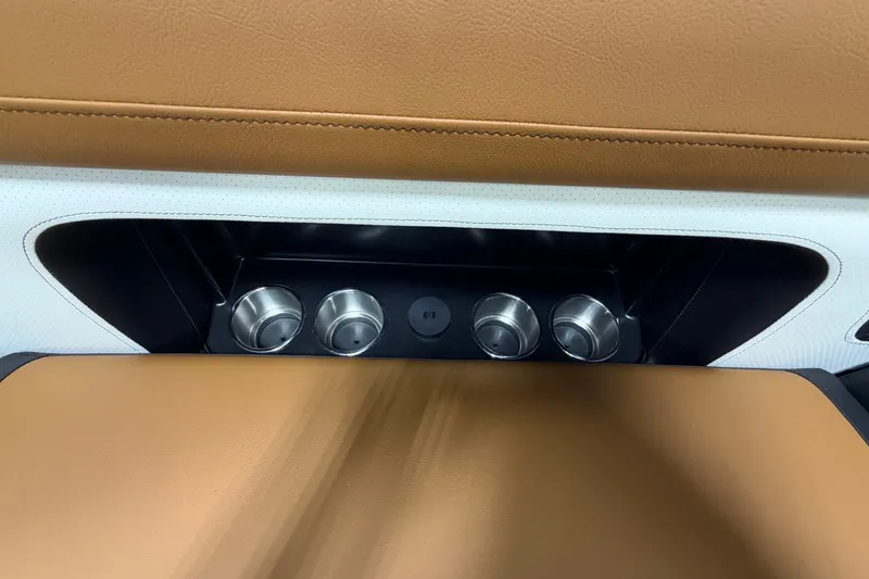 Slide: The Image of Interior of 2027 Premier 230 Solaris RF - CL with cup holders and brown leather seating. - 9