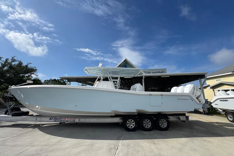 The Image of 2017 Invincible 39 Open Fisherman boat on trailer under clear blue sky. - 1