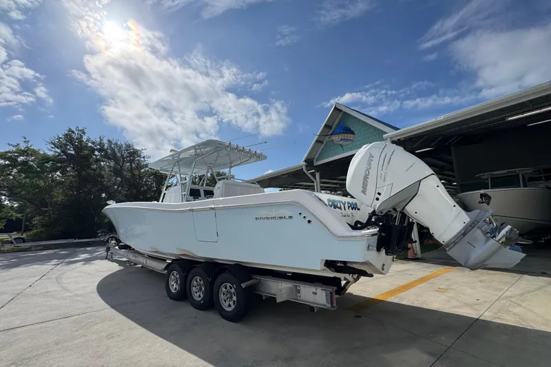 Slide: The Image of 2017 Invincible 39 Open Fisherman boat on trailer under sunny sky. - 15