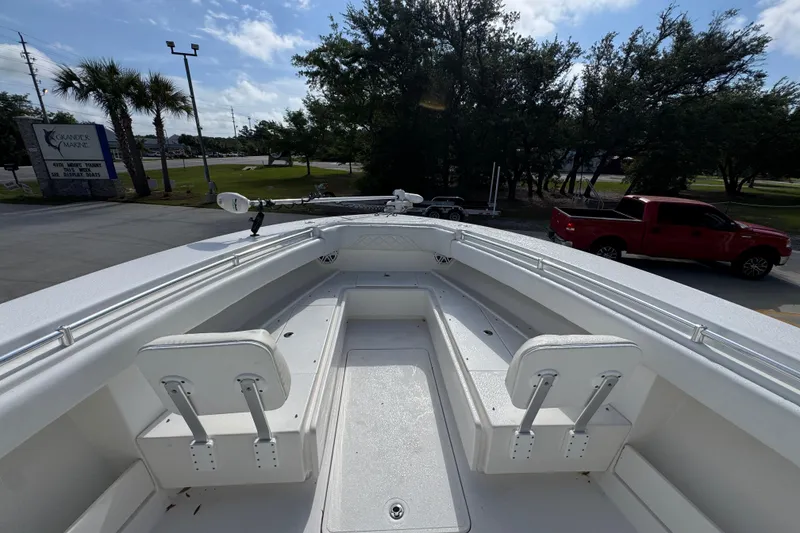 Slide: The Image of 2017 Invincible 39 Open Fisherman boat interior with seating and fishing equipment. - 17