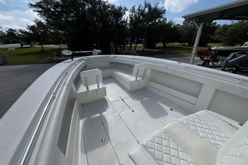 Slide: The Image of 2017 Invincible 39 Open Fisherman boat interior with white seating and spacious deck. - 18