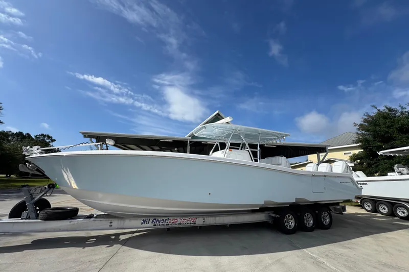 Slide: The Image of 2017 Invincible 39 Open Fisherman boat on trailer under clear blue sky. - 2