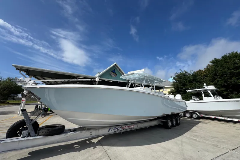 Slide: The Image of 2017 Invincible 39 Open Fisherman boat on trailer under clear blue sky. - 3