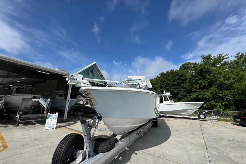 Slide: The Image of 2017 Invincible 39 Open Fisherman boat on trailer under clear blue sky. - 5