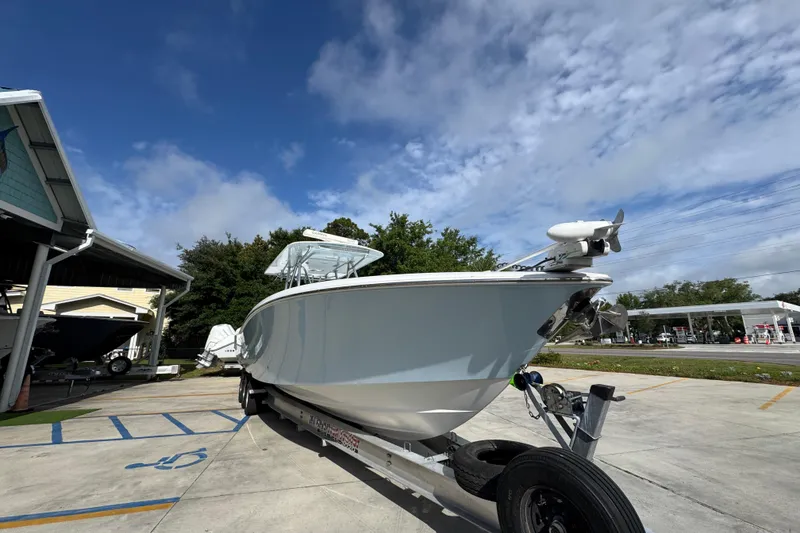 Slide: The Image of 2017 Invincible 39 Open Fisherman boat on trailer under blue sky. - 7
