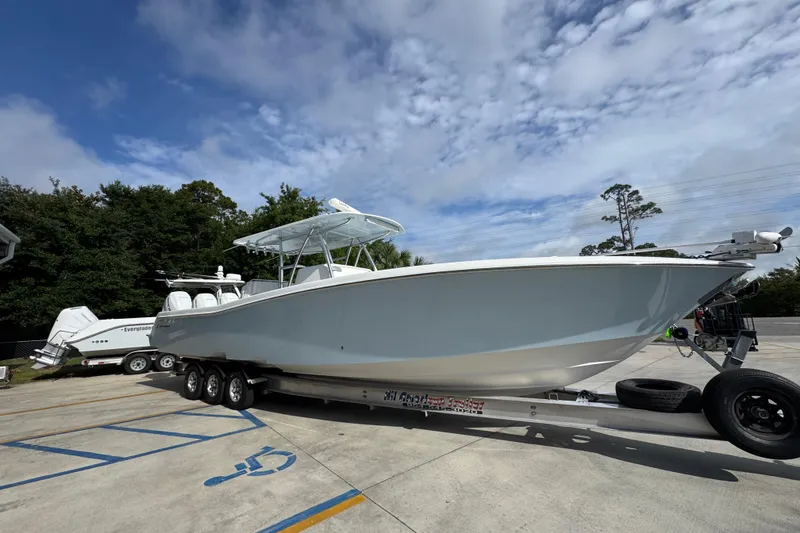 Slide: The Image of 2017 Invincible 39 Open Fisherman boat on trailer under cloudy sky. - 8