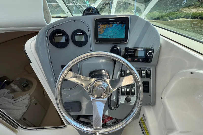 Slide: The Image of Steering console of 2016 Wellcraft 252 Coastal boat with navigation instruments. - 13
