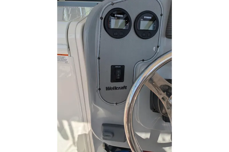 Slide: The Image of Control panel of 2016 Wellcraft 252 Coastal boat with Yamaha gauges and steering wheel. - 15