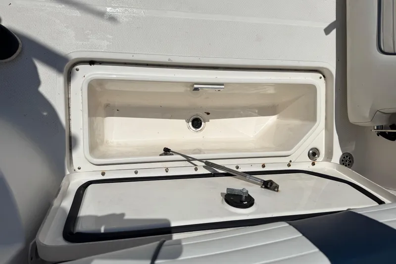 Slide: The Image of Open storage compartment on a 2016 Wellcraft 252 Coastal boat, showcasing interior details. - 20